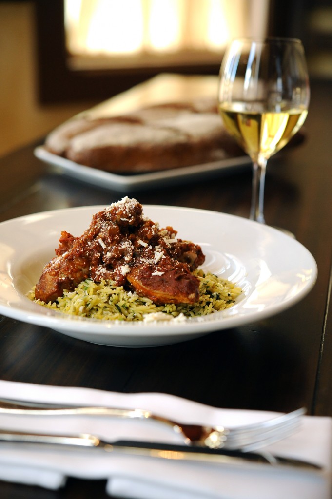 Kouzzina Cinnamon-stewed chicken, with tomatoes, herbed orzo and Mizithra cheese
