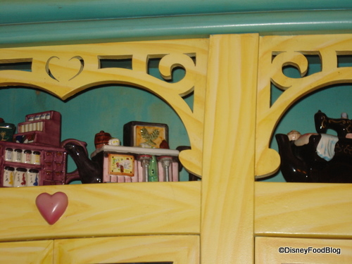 Minnie's Stores Collected Teapots Above the Cabinets