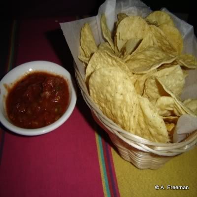 Tortilla Chips and Salsa are served to every table