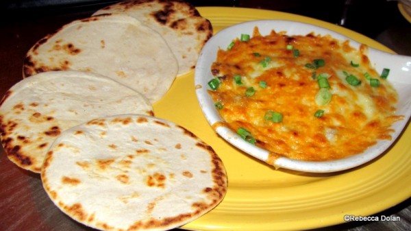 Queso fundito and accompanying tortillas for scooping