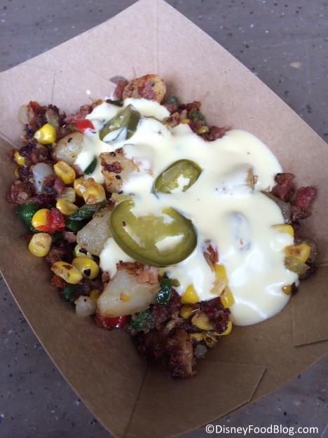 Nueske’s® Pepper Bacon Hash with sweet corn, potatoes, hollandaise and pickled jalapeño