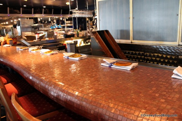 Bar seating in front of the kitchen