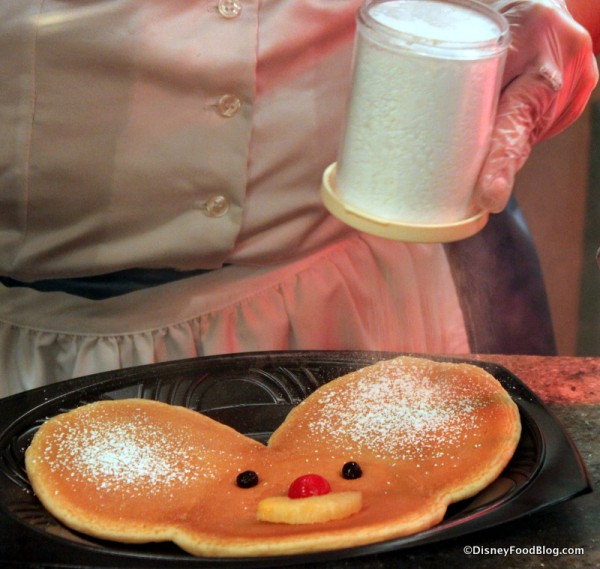 Dusting My Mickey Pancake with Powdered Sugar