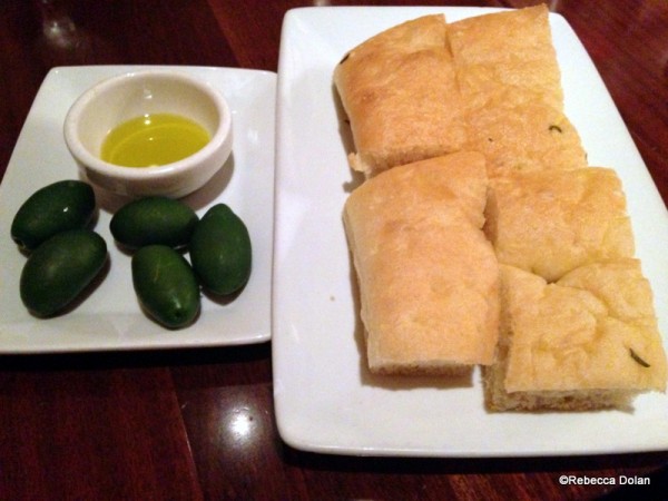 Focaccia and olives to eat while you look over the menu