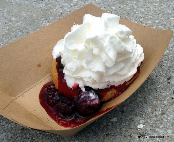 Belgium waffle with berry compote and whipped cream