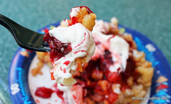 Close up on Funnel Cake with strawberry topping.