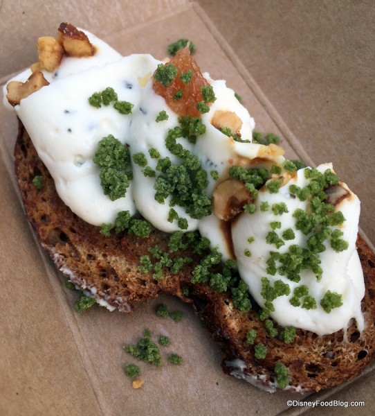 Chèvre fromage blanc tartine infused with rosemary and honey, topped with toasted hazelnuts