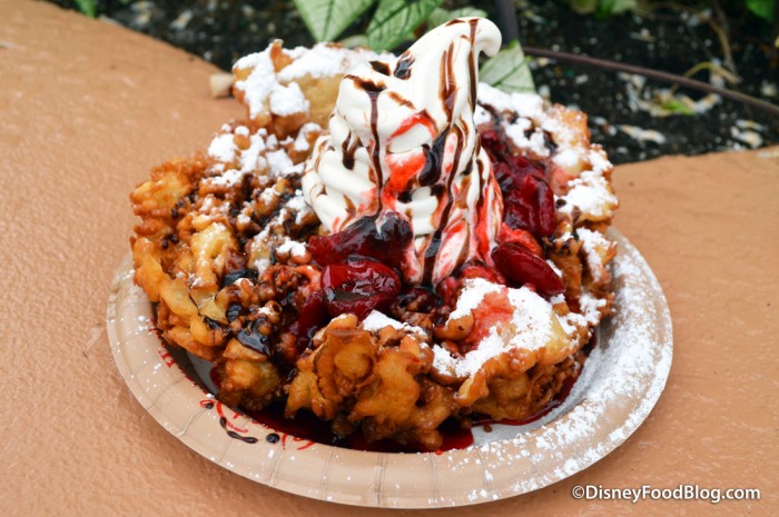 Funnel Cake with Vanilla Soft Serve, Strawberry Sauce, and Chocolate Drizzle