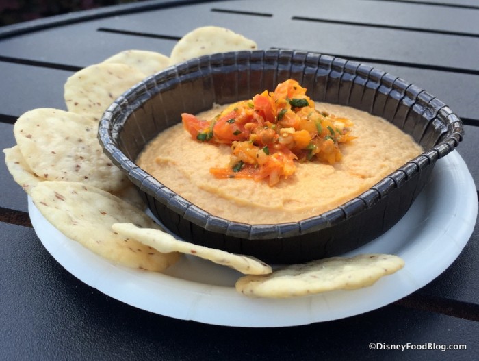 Fire-roasted Tomato Hummus topped with Blue Diamond Salt & Vinegar Almonds and served with Blue Diamond Nut Thins