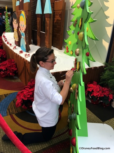 Putting the Final Touches on the Contemporary Resort Gingerbread Display 