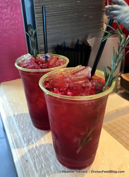 Pomegranate Mule with Pomegranate Seeds and Rosemary Sprig