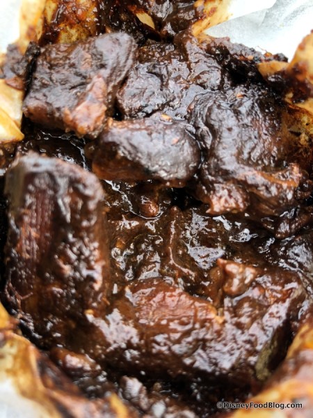 Mixiote de Cordero: Wrapped Slow Braised Lamb marinated in Tres Chiles Paste and Spices