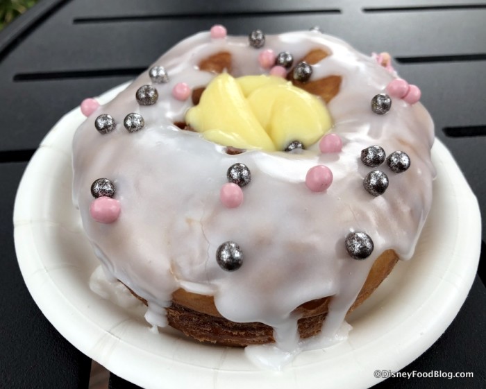 Croissant Doughnut filled with Pastry Cream and topped with Colored Pearls