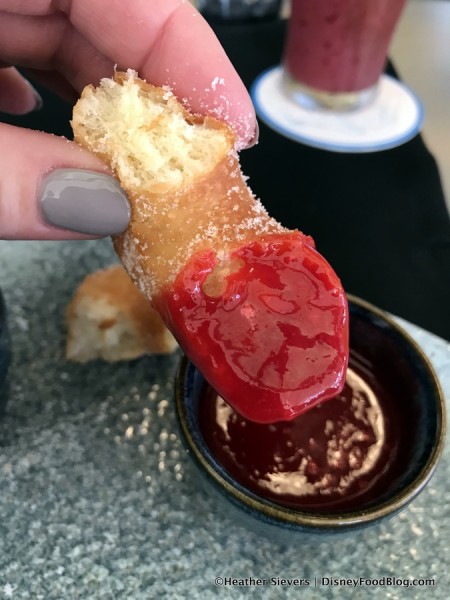 Donut dipped in Raspberry Sauce