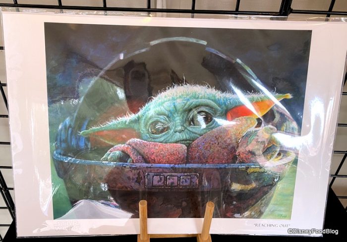disney world epcot festival of the arts baby yoda reaching out 700x488