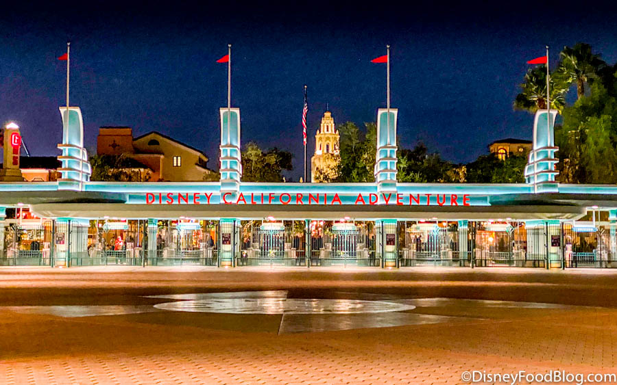 Disneyland California entrance at night with neon lights