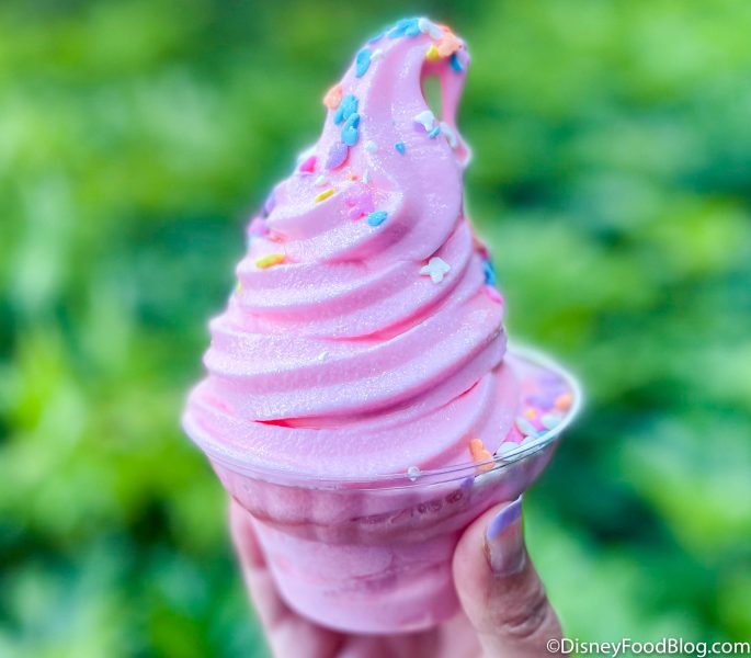 Spoon digging into an ice cream sundae, a cold and sweet adventure