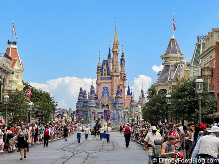 https://www.disneyfoodblog.com/wp-content/uploads/2021/07/Disney-World-Princess-Calvacade-Merida-50th-Anniversary-Cinderella-Castle-Summer-2021-July-Mainstreet-U.S.A-700x525.jpg