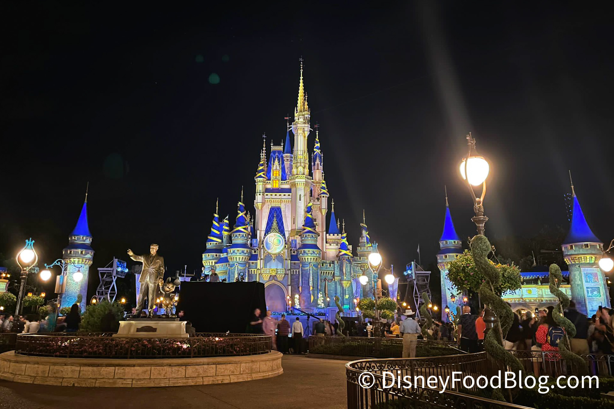 https://www.disneyfoodblog.com/wp-content/uploads/2021/09/2021-WDW-Magic-Kingdom-Cinderella-Castle-50th-Anniversary-Celebration-Nighttime-Lightning-Beacons-of-Magic-2.jpg