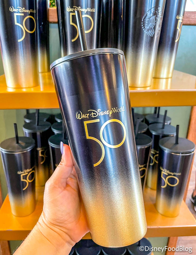 https://www.disneyfoodblog.com/wp-content/uploads/2021/12/2021-wdw-epcot-port-of-entry-50th-anniversary-black-and-gold-starbucks-tumblers-restocked-2.jpg