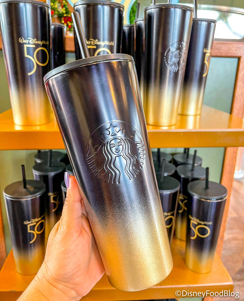 https://www.disneyfoodblog.com/wp-content/uploads/2021/12/2021-wdw-epcot-port-of-entry-50th-anniversary-black-and-gold-starbucks-tumblers-restocked-4.jpg