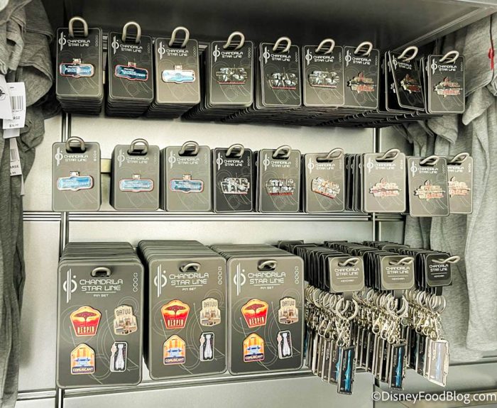 2022-wdw-star-wars-galactic-starcruiser-hotel-media-preview-event-merchandise-at-terminal-pins-keychains-700x575.jpg