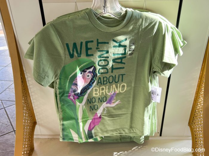https://www.disneyfoodblog.com/wp-content/uploads/2022/10/2022-dlr-disneyland-its-a-small-world-gift-shop-we-dont-talk-about-bruno-youth-shirt-700x525.jpg