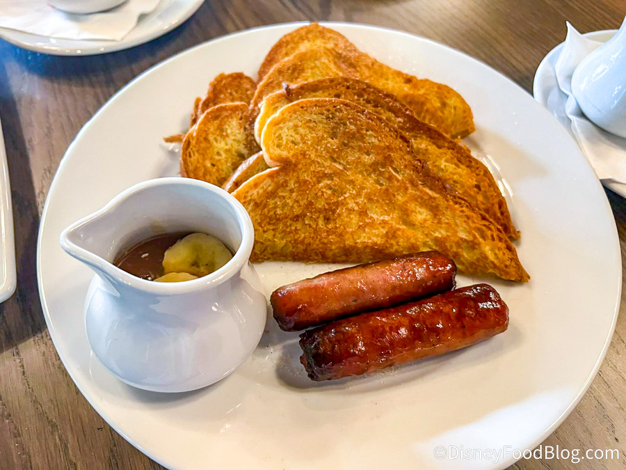 https://www.disneyfoodblog.com/wp-content/uploads/2022/11/2022-wdw-polynesian-village-resort-kona-cafe-reopening-renovations-french-toast-with-sausage.jpg