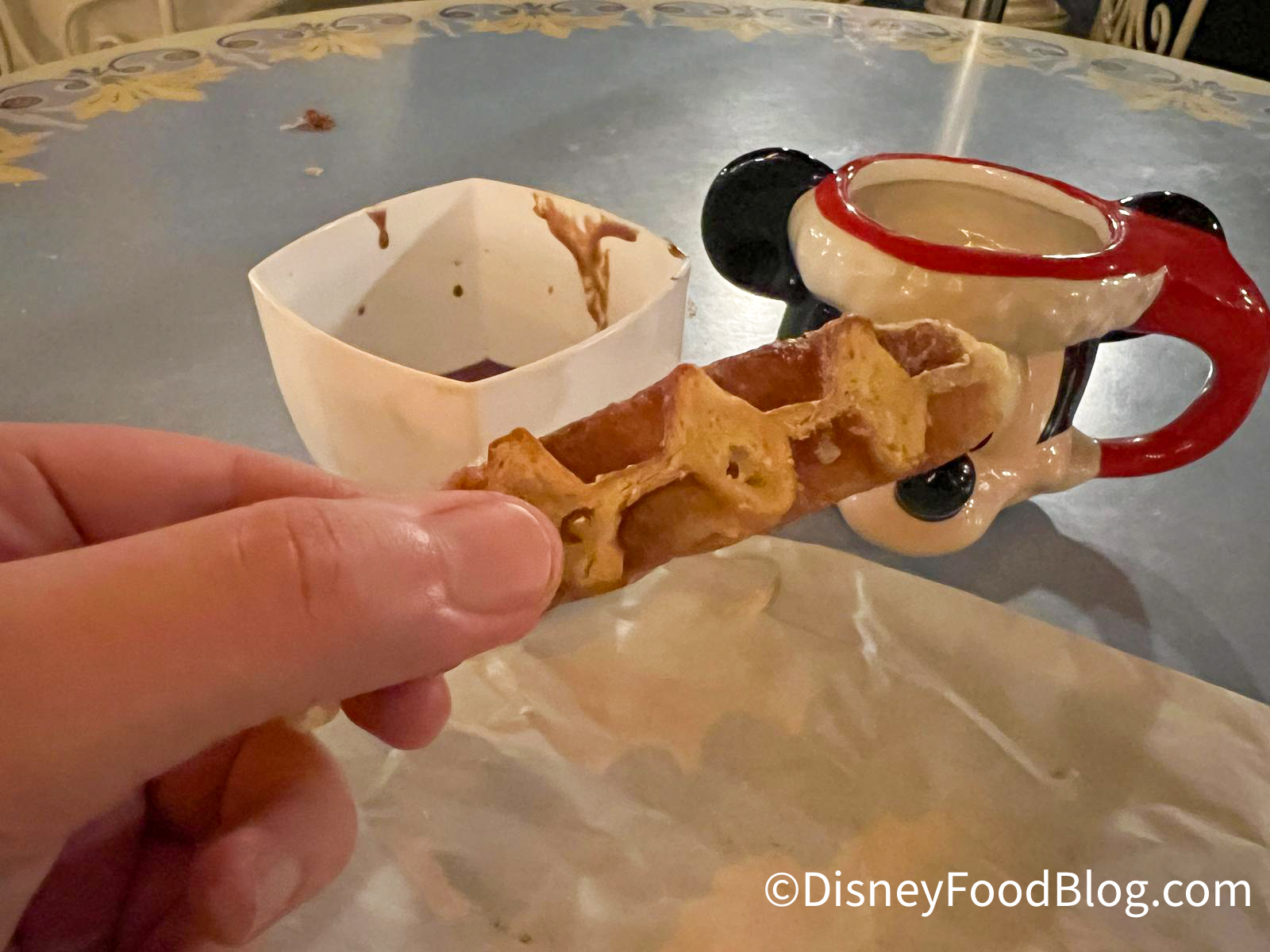 https://www.disneyfoodblog.com/wp-content/uploads/2022/12/2022-Disneyland-Santa-Mickey-Demitasse-Mug-with-Sweet-Waffles-with-Sipping-Chocolate-Waffle-1.jpg