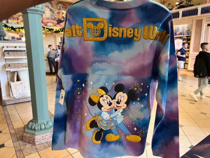 https://www.disneyfoodblog.com/wp-content/uploads/2023/01/2023-Walt-Disney-World-50th-Anniversary-Merchandise-Magic-Kingdom-Emporium-Spirit-Jersey-Back-700x525.jpg